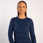 Woman wearing the navy blue Motion Core Long Sleeve Top by sporton.active