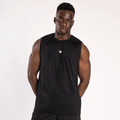 A man wearing a plain black sleeveless tank top with a small white circular logo on the upper chest stands against a plain white background.
